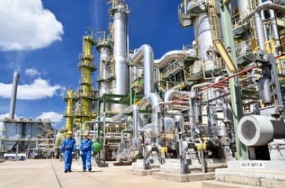 Technicians at work in a refinery unit
