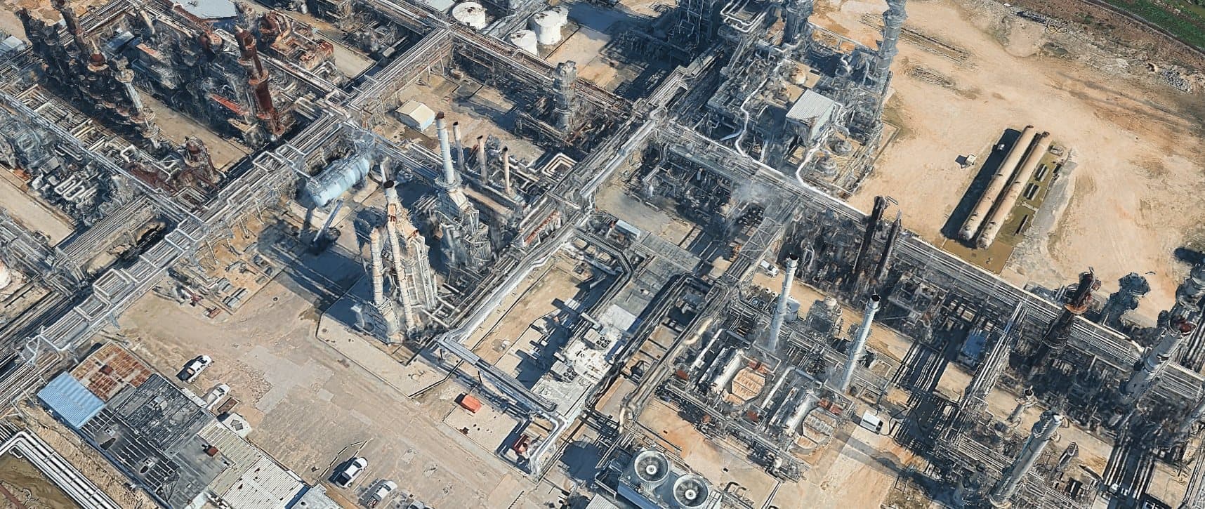 Aerial view of refinery process stacks